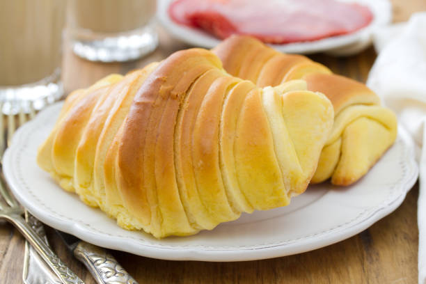 istock croissants on plate and coffee with milk 658461690