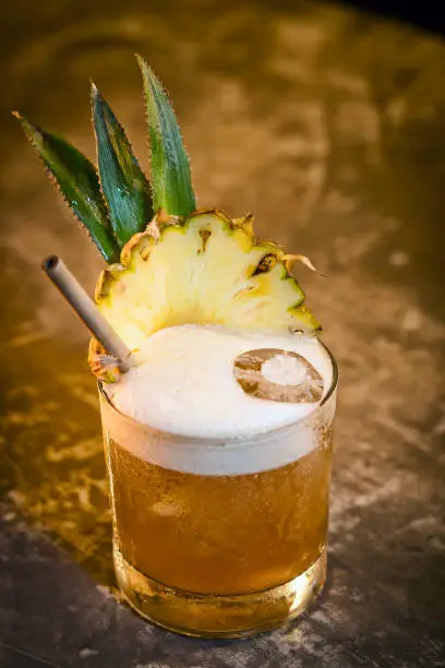 Photo of pineapple mango tropical rum fruity cocktail drink