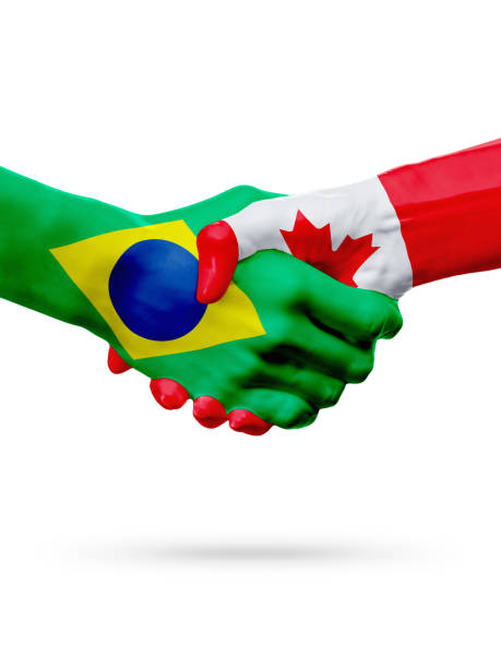istock Flags Brazil, Canada countries, partnership friendship handshake concept. 658468914