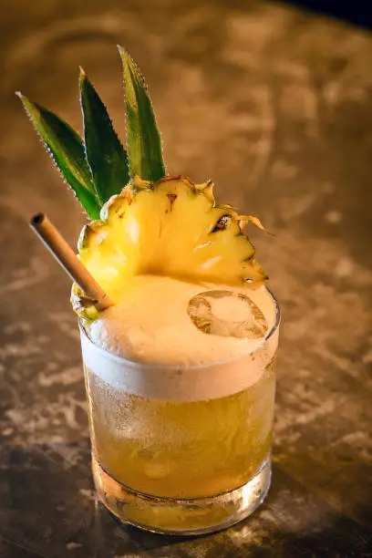 Photo of pineapple mango tropical rum fruity cocktail drink