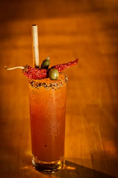 Photo of spicy bloody mary tomato cocktail drink