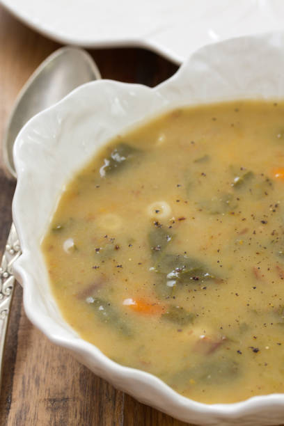 istock vegetable soup in white bowl on brown background 658469954
