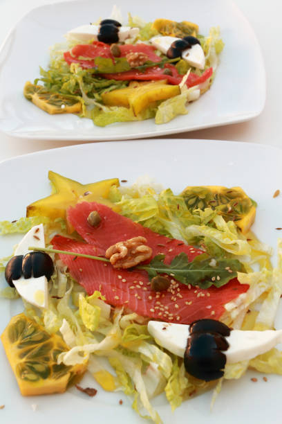 istock Two tropical salads with salmon 658472858