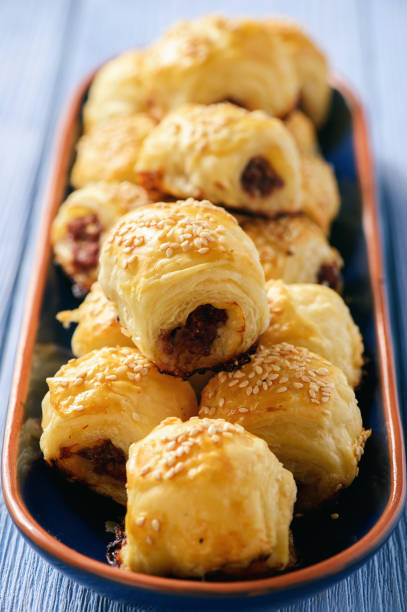 istock Homemade sausage rolls on wooden background. 658476982