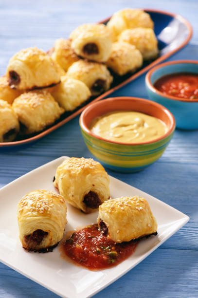 istock Homemade sausage rolls on wooden background. 658477002