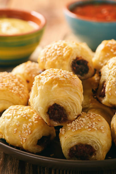 istock Homemade sausage rolls on wooden background. 658477078