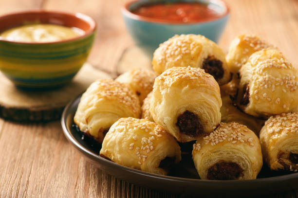 istock Homemade sausage rolls on wooden background. 658477096