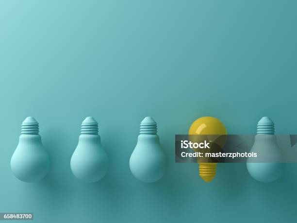 Think Different Concept One Yellow Light Bulb Standing Out From The Unlit Green Incandescent Lightbulbs With Reflection And Shadow Leadership And Different Creative Idea Concept 3d Render Stock Photo - Download Image Now