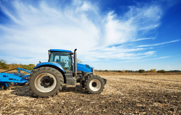 istock Agricultural tractor in the field 658484302