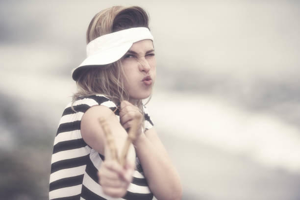 istock angry woman with slingshot 658487552
