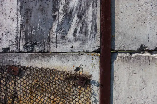 Photo of Concrete blocks, metal bar and metal mesh.