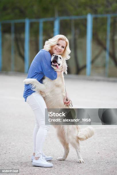 Young Beautiful Blonde With The Dog Breed Golden Retriever Stock Photo - Download Image Now - iStock Young Beautiful Blonde With The Dog Breed Golden Retriever Stock Photo - Download Image Now - iStock