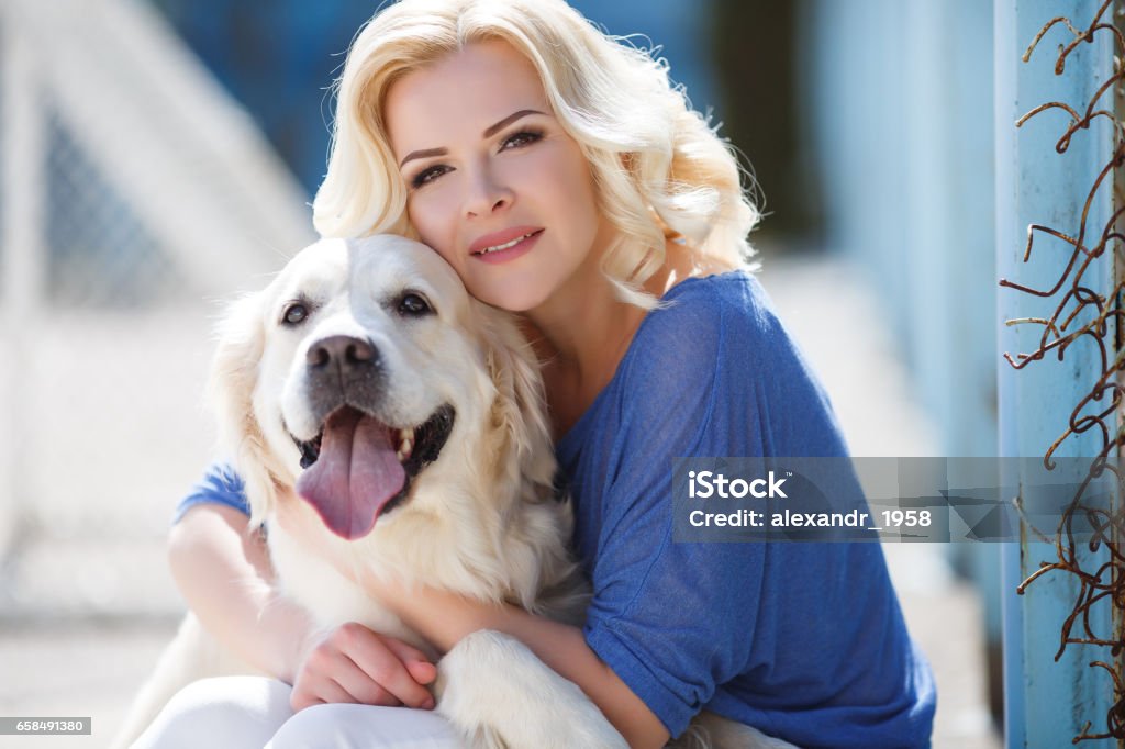 Young Beautiful Blonde With The Dog Breed Golden Retriever Stock Photo - Download Image Now - iStock Young Beautiful Blonde With The Dog Breed Golden Retriever Stock Photo - Download Image Now - iStock