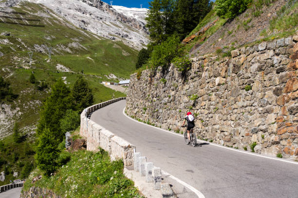 istock Biker rides serpentine mountain road 658495544