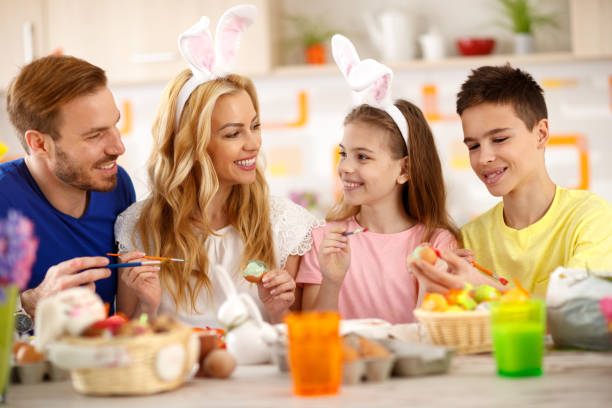 istock Family painting Easter eggs 658495772