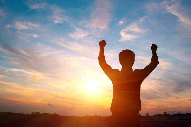 istock silhouette of a happy man and  sunset 658502188