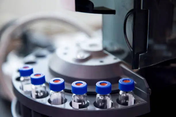 vials are arranged in the auto-sampler for the lab equipment.