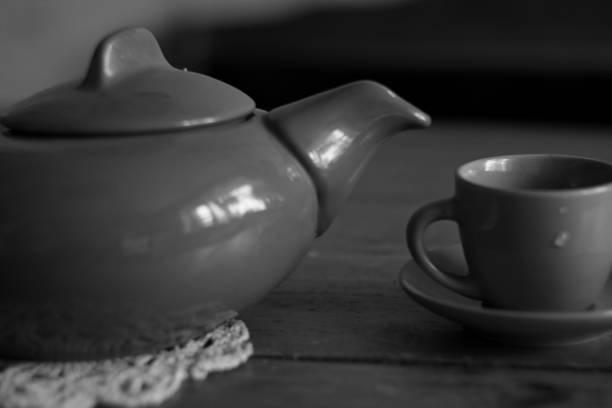 istock Close up vintage tea pot and cup in black and white style 658521354