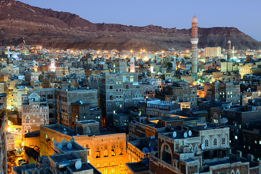 Old city of Sanaa the capital of Yemen. View on the city from roof at sunset time