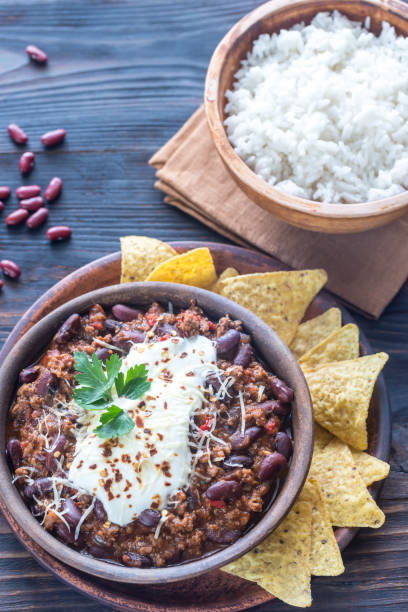istock Bowl of chili con carne with white rice 658526564