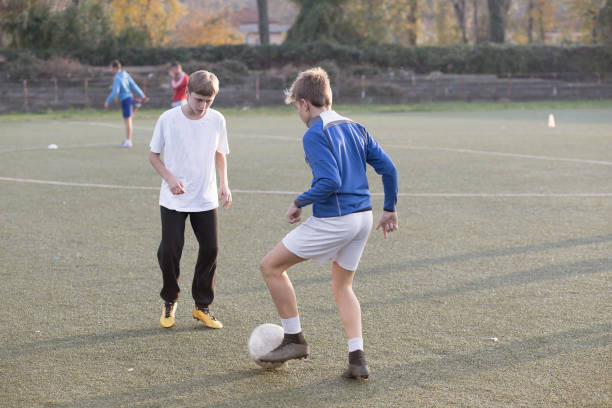 istock Young football players passing 658530570