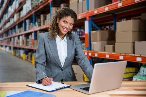 istock Business woman writing on her clipboard 658530588
