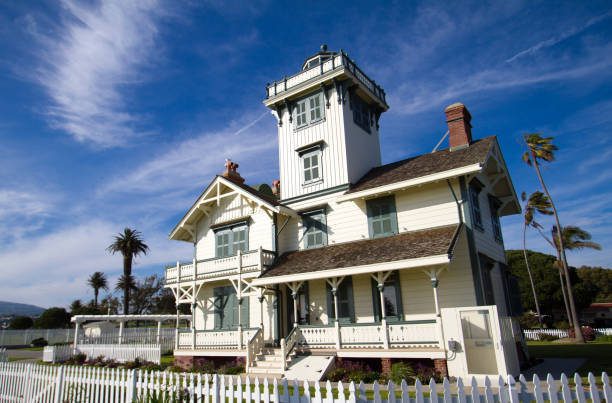 San Pedro, CA, USA: The Point Fermin Lighthouse Historic Site—a Victorian structure with white picket fence, dating from 1874. San Pedro is part of the city of Los Angeles, next to Long Beach.