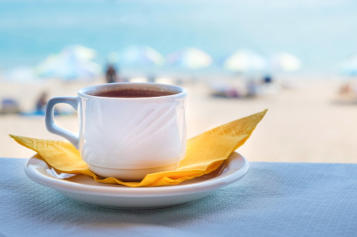 Mediterranean cup of coffee at the beach