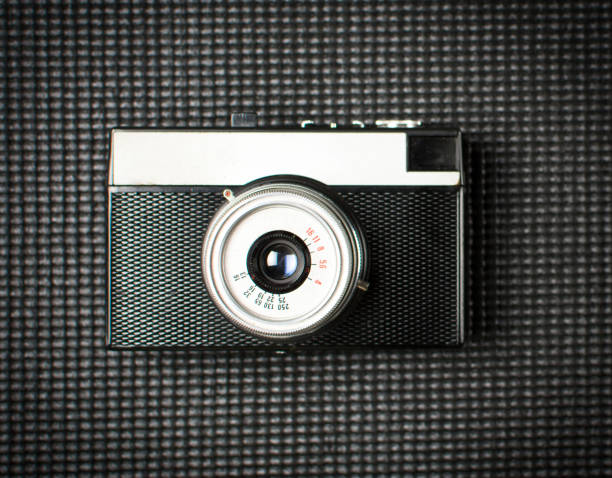 istock Vintage film camera on dark background 658535668