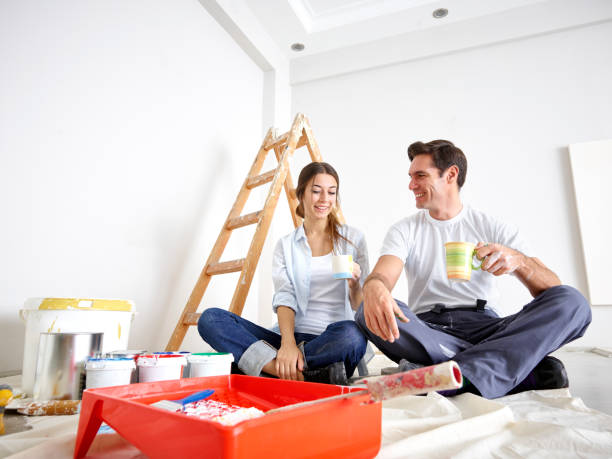 istock Couple taking a break from painting 658536024
