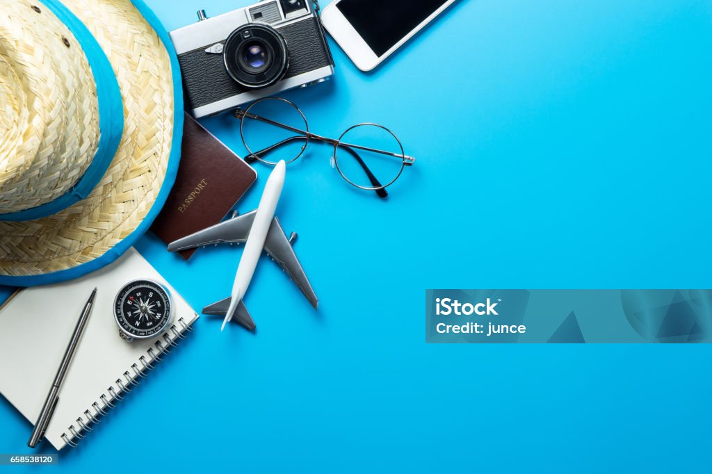 Travel accessories with copy space on blue background Travel Stock Photo