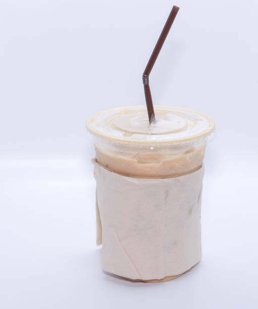 istock Iced coffee with straw in plastic cup on white background 658538584