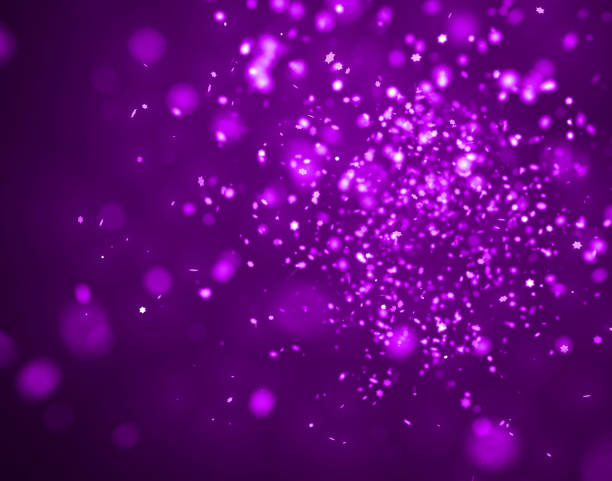 istock star-shaped purple glittery bokeh in front of a dark purple background 658538692