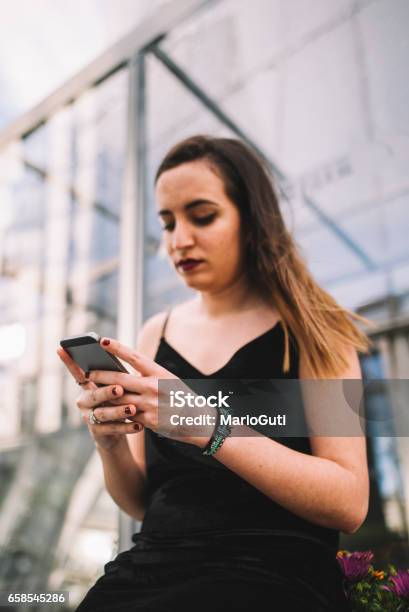 Young Woman Using Smartphone Stock Photo - Download Image Now - 20-29 Years, Adolescence, Adult