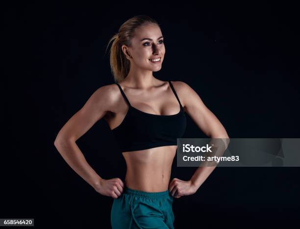 Shot Of A Strong Woman With Muscular Abdomen In Sportswear Fitness