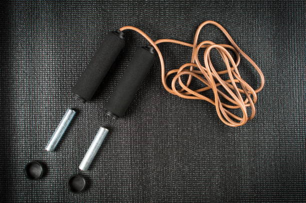 istock Jump rope with weights on yoga mat 658557188