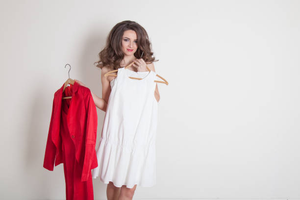 istock a girl chooses between red and white 658557406