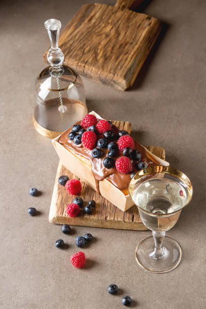 istock Christmas cake with chocolate frosting, blueberries and raspberr 658557980