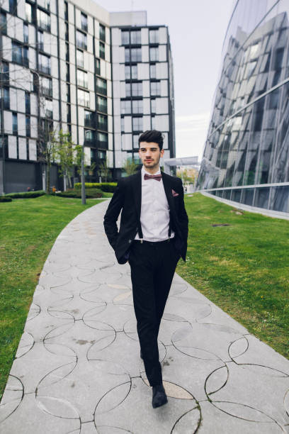 A young man wearing a suit