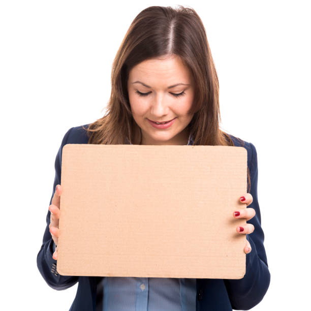 donna d'affari in possesso di un cartone - advertisement advertise businesswoman peeking foto e immagini stock