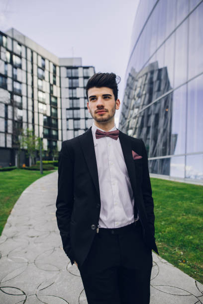 A young man wearing a suit