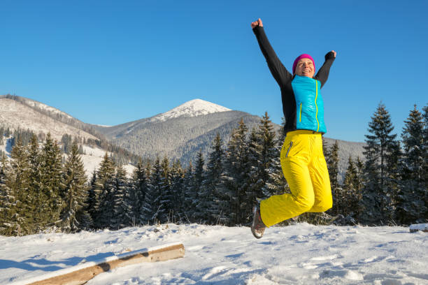istock Woman having fun in winter  mountains 658561766