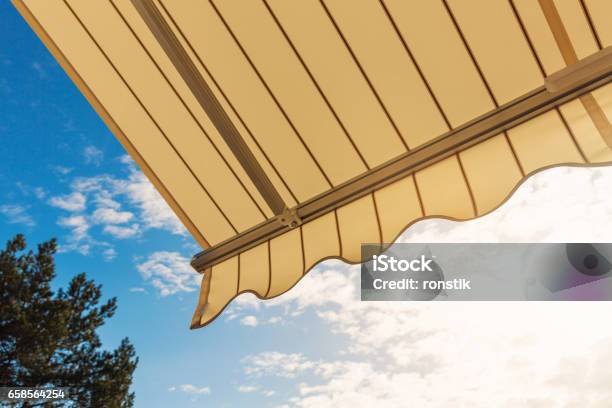 Awning Against Blue Sunny Sky Stock Photo - Download Image Now - Patio, Sunshade, Awning