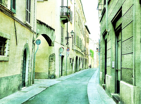 Medieval italian street in vintage style. Green filter effect.
