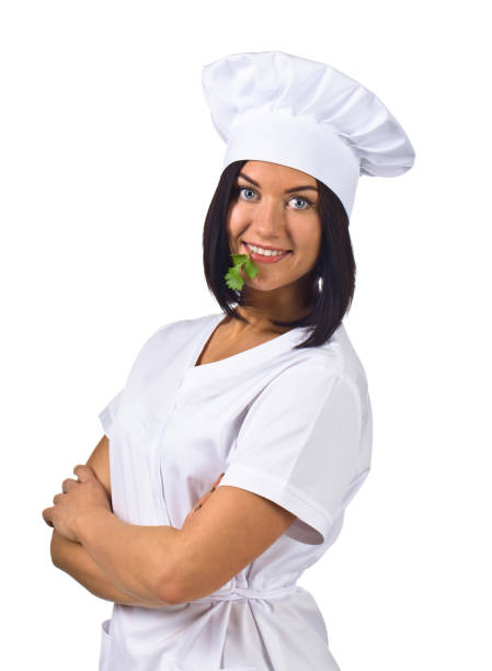 istock young woman in chef uniform with parsley isolated on white 658565074