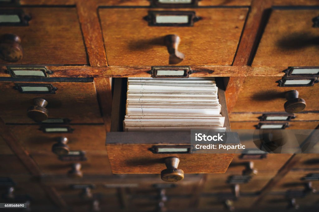 File catalog box Open old style wooden drawer with index cards. Library Stock Photo