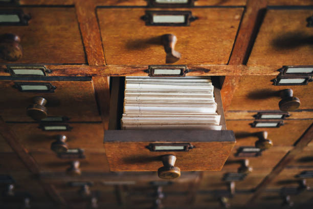 File catalog box Open old style wooden drawer with index cards. filing cabinet stock pictures, royalty-free photos & images