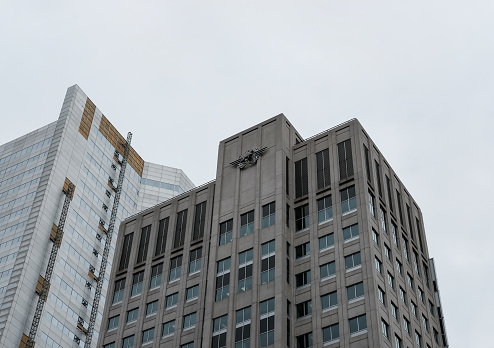 Architecture view of the headquarters of the ICAO building in central Montreal, showing detail of this and the adjacent building as seen in the city centre in autumn.