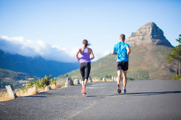 istock Personal Trainer and his female athlete out on a run together 658583390