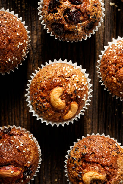 istock Nut chocolate muffins homemade on rustic wooden table 658584138